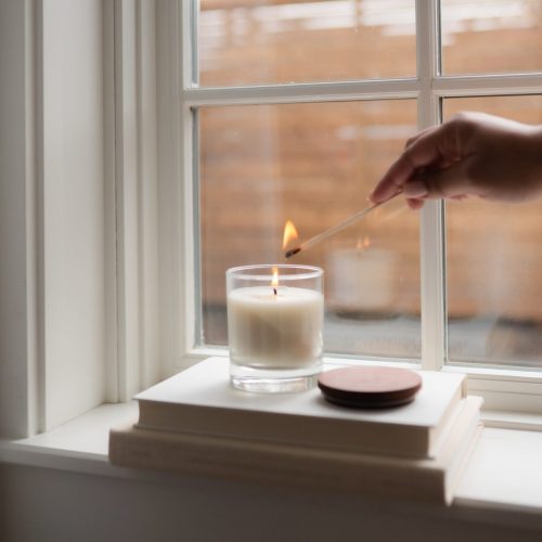 Lighting a soy wax candle