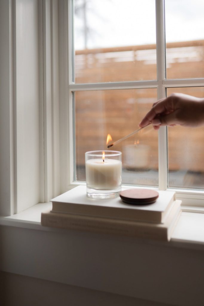 Lighting a soy wax candle